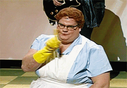 A Woman Wearing A Blue Apron And Yellow Gloves Is Sitting On The Floor GIF