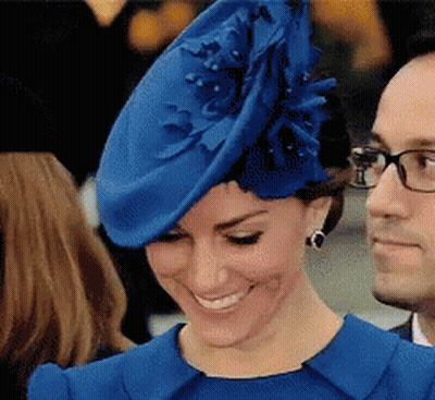 A Woman Wearing A Blue Hat And A Blue Dress GIF