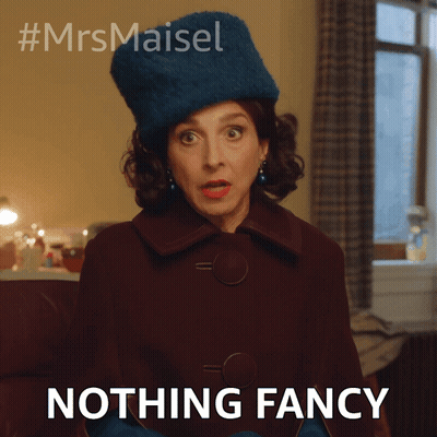 A Woman Wearing A Blue Hat And Gloves Says " Nothing Fancy " GIF