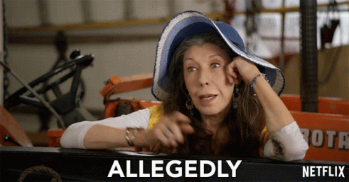 A Woman Wearing A Blue Hat Says Allegedly In Front Of A Tractor GIF