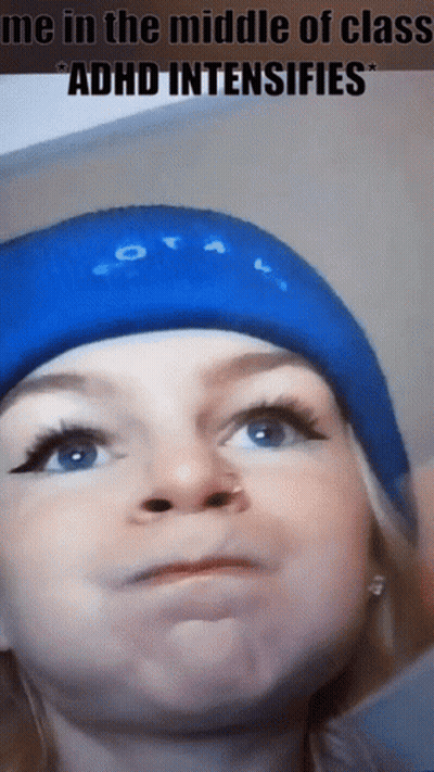 A Woman Wearing A Blue Hat With The Words Me In The Middle Of Class Adhd Intensifies Written On It GIF