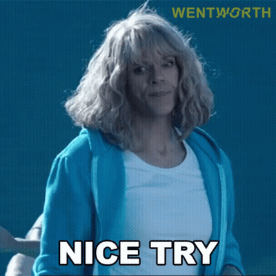 A Woman Wearing A Blue Jacket And White Shirt Says Nice Try GIF