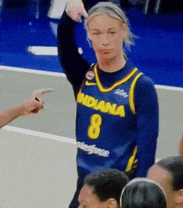 A Woman Wearing A Blue Jersey That Says Indiana 8 On It GIF