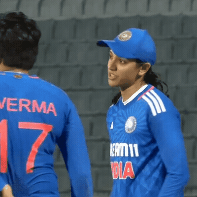 A Woman Wearing A Blue Jersey With The Number 17 On The Back GIF