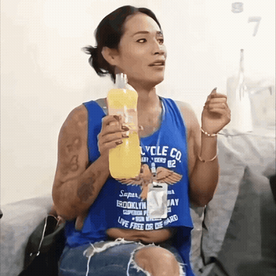 A Woman Wearing A Blue Shirt That Says Cycle Co. On It GIF