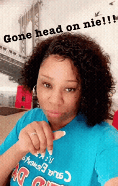 A Woman Wearing A Blue Shirt That Says Gone Head On Nie ! GIF