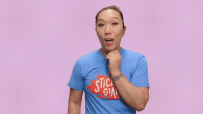A Woman Wearing A Blue Shirt That Says Hump Day On It GIF