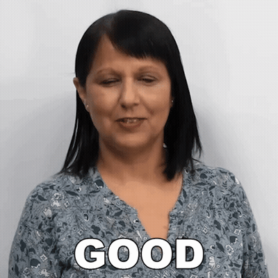 A Woman Wearing A Blue Shirt With The Word Good On It GIF