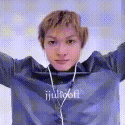 A Woman Wearing A Blue Sweater With The Word Julioff On It GIF