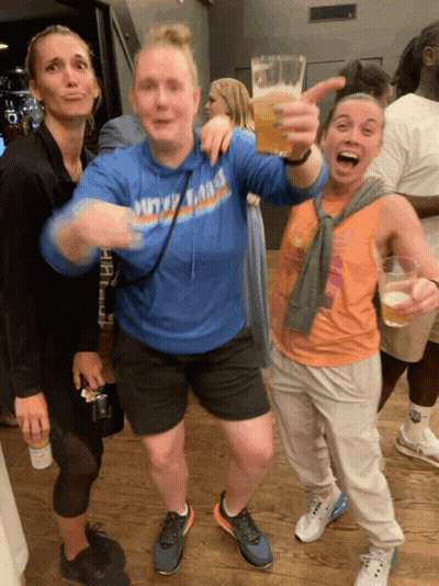 A Woman Wearing A Blue Sweatshirt That Says Duty Of Fame GIF