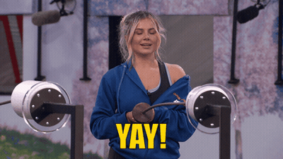 A Woman Wearing A Blue Sweatshirt With The Word Yay On The Front GIF