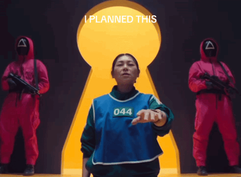 A Woman Wearing A Blue Vest With The Number 044 Stands In Front Of A Keyhole GIF