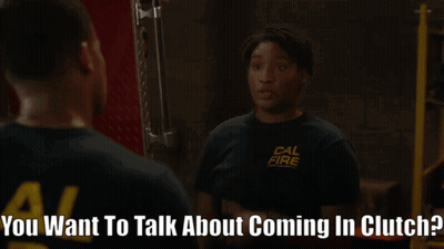 A Woman Wearing A Cal Fire Shirt Is Talking To Another Woman GIF