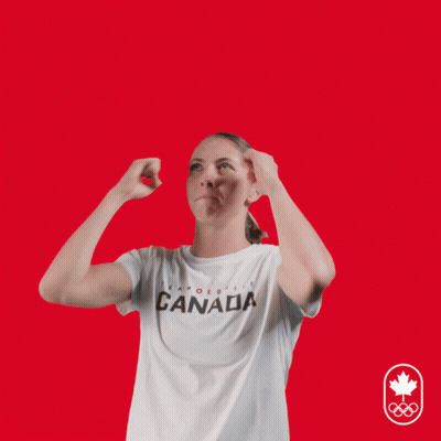A Woman Wearing A Canada T-Shirt Has Her Hands Up In The Air GIF