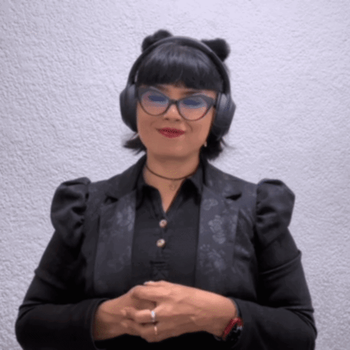 A Woman Wearing A Cat Ear Headband And Headphones GIF