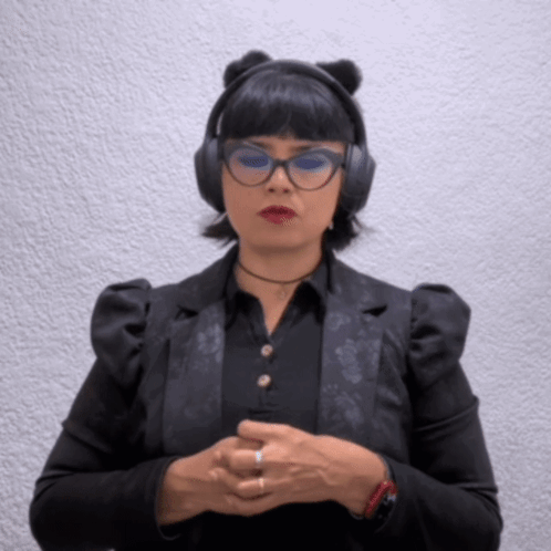 A Woman Wearing A Cat Ear Headband And Headphones GIF