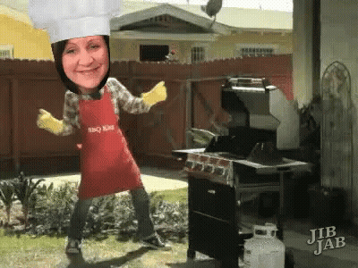 A Woman Wearing A Chef 'S Hat And An Apron That Says Bbq King GIF