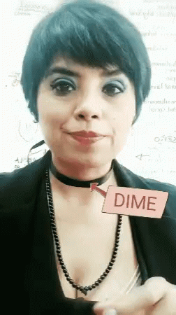 A Woman Wearing A Choker And A Necklace Is Holding A Pink Card That Says Dime GIF