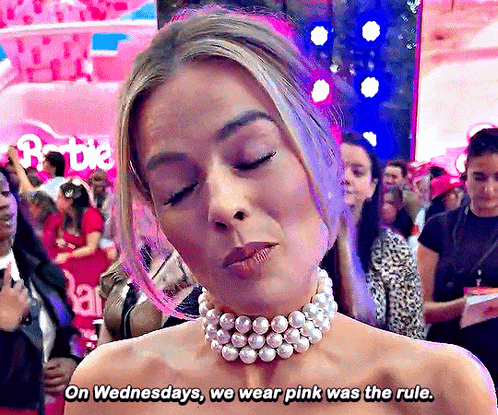 A Woman Wearing A Choker And Pearls Says On Wednesdays We Wear Pink Was The Rule GIF