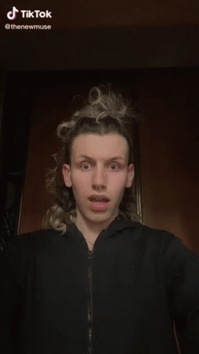 A Woman Wearing A Choker Is Being Touched By A Man 'S Hand .. GIF
