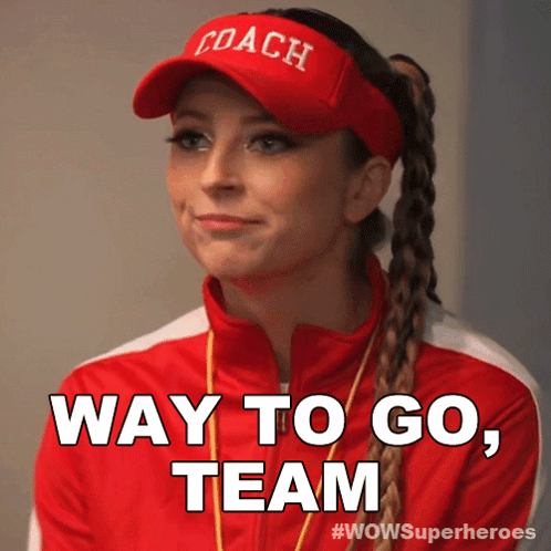 A Woman Wearing A Coach Hat And A Red Jacket Says Way To Go Team GIF