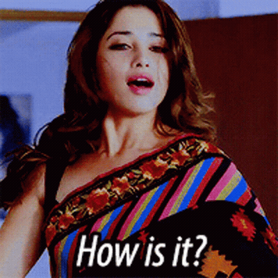 A Woman Wearing A Colorful Striped Saree Is Asking " How Is It " GIF