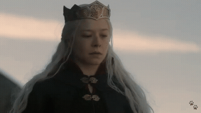 A Woman Wearing A Crown And A Black Coat GIF