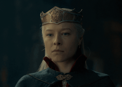 A Woman Wearing A Crown And A Cape GIF