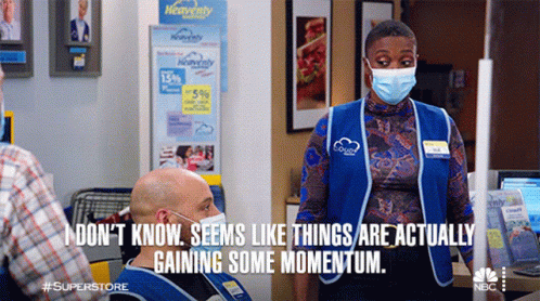 Woman In Face Mask Saying Things Are Gaining Momentum GIF