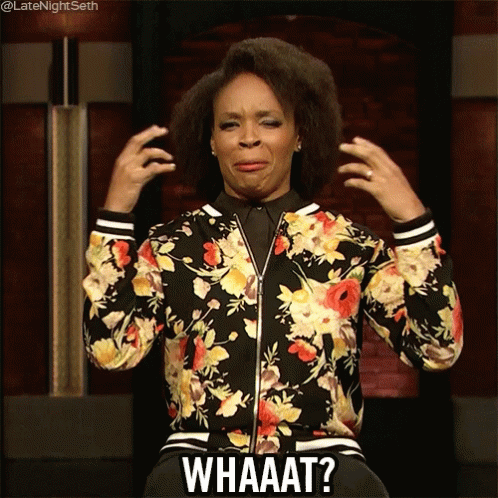 A Woman Wearing A Floral Jacket Is Making A Funny Face And Says Whaaat GIF