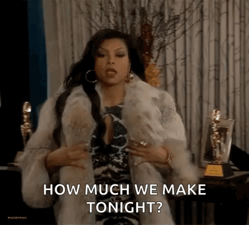 A Woman Wearing A Fur Coat Is Sitting In Front Of A Curtain And Asking How Much We Make Tonight . GIF