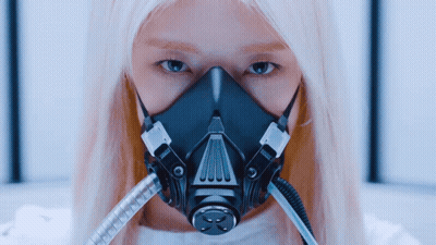 A Woman Wearing A Gas Mask With The Letter X On It GIF