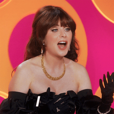 A Woman Wearing A Gold Necklace And Black Gloves Has Her Mouth Wide Open GIF
