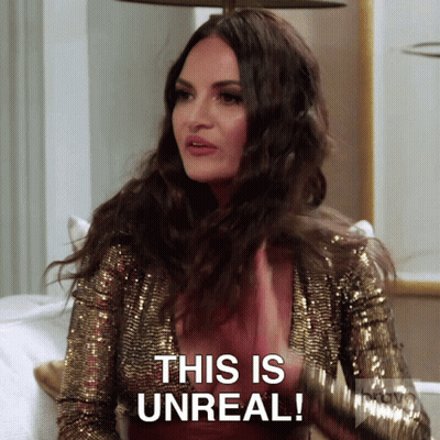 A Woman Wearing A Gold Sequined Jacket Says This Is Unreal GIF