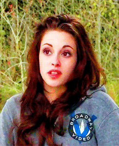 A Woman Wearing A Gray Broadway Video Hoodie GIF
