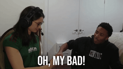 A Woman Wearing A Green Adidas Shirt Talks To A Man GIF