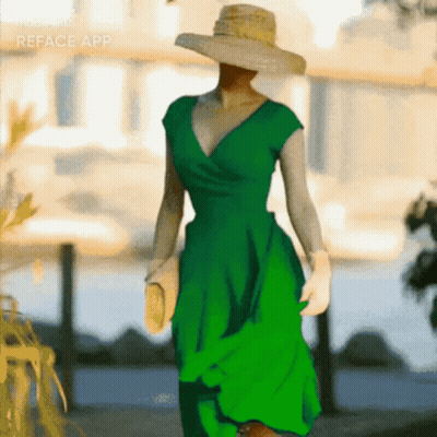 A Woman Wearing A Green Dress And A Straw Hat Is Made With The Reface App GIF