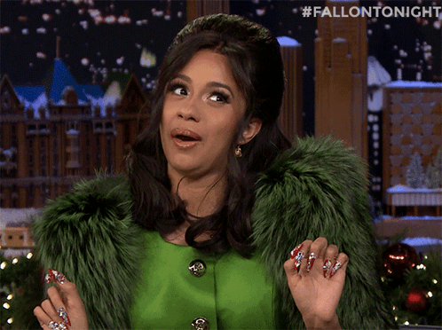 A Woman Wearing A Green Fur Coat And A Headband With The Hashtag #Fallontonight GIF