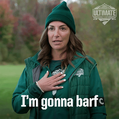 A Woman Wearing A Green Jacket That Says I 'M Gonna Barf On It GIF