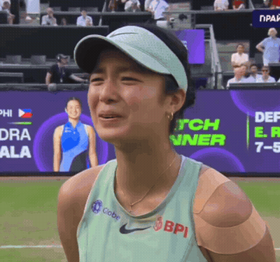 A Woman Wearing A Green Nike Tank Top With Bpi Written On It GIF