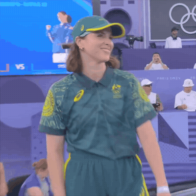 A Woman Wearing A Green Shirt That Says Australia Olympics On It GIF