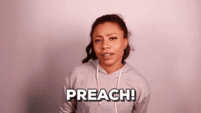 A Woman Wearing A Grey Hoodie With The Word Preach Written On It GIF