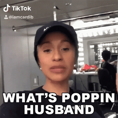 A Woman Wearing A Hat And A Black Shirt Says What 'S Poppin Husband GIF