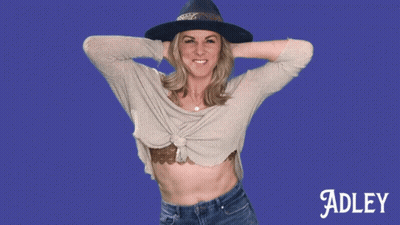 A Woman Wearing A Hat And A Sweater Is Named Adley GIF