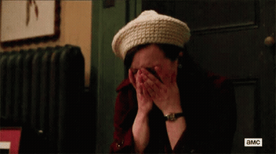A Woman Wearing A Hat And A Watch Is Crying . GIF