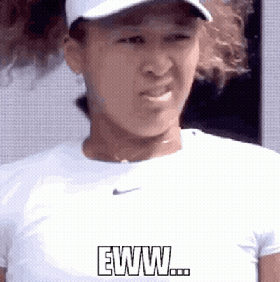A Woman Wearing A Hat And A White Shirt Is Making A Funny Face And Says Eww . GIF