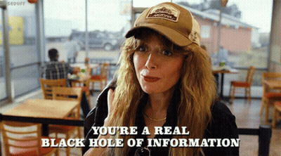 A Woman Wearing A Hat Says " You 'Re A Real Black Hole Of Information " In A Restaurant GIF