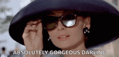A Woman Wearing A Hat , Sunglasses , And Pearl Earrings Is Absolutely Gorgeous Darling . GIF