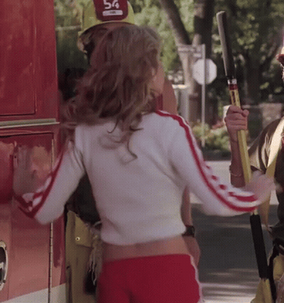 A Woman Wearing A Hat That Says 54 On It GIF