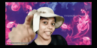 A Woman Wearing A Hat With The Name Vyshnav K Pradeep At The Bottom GIF